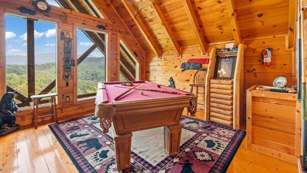 A wooden cabin with a pool table, a fire extinguisher, and a scenic view. - Incredible MTN Views*Hot Tub + Game Room*Fireplace (Pigeon Forge)