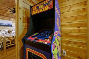 An arcade machine with a colorful design, a joystick, and a start game button. - New! 3BR w/Hot Tub*Game Room*Comm Pools*Fireplace (Gatlinburg)