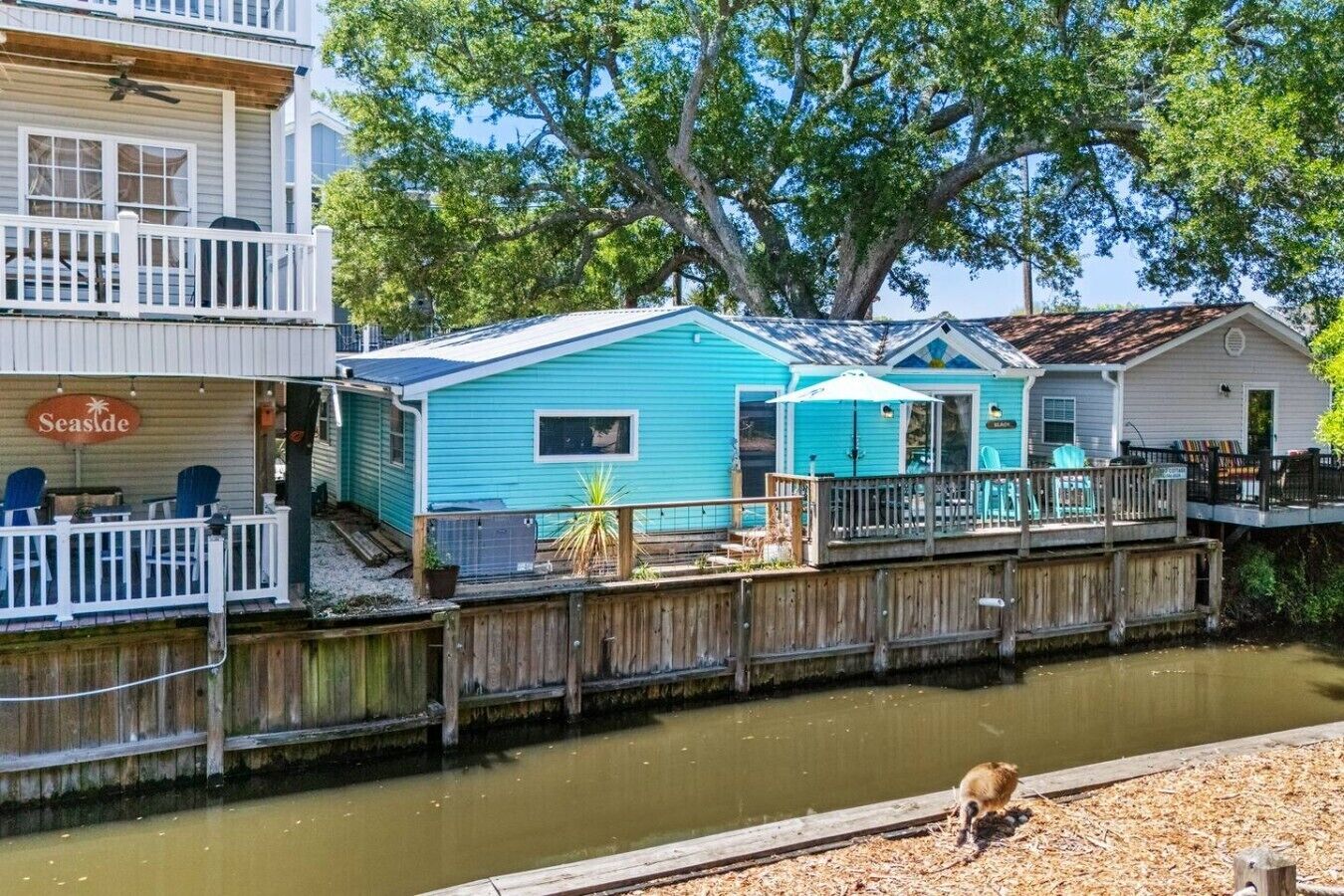 A waterfront property with a dock, a small building, and a restaurant named 'Seaside.'
