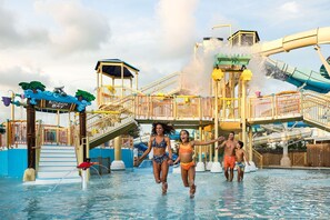 A water park with a wave pool, slides, and a play area.