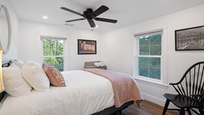 A bedroom with a bed, a ceiling fan, two windows, and a chair. - 8 Mile House by Avantstay Historic 1877 Ranch + Party Barn Wine Country (Santa Margarita)