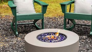 A circular outdoor fire pit with a white cushion on a table, surrounded by green Adirondack chairs with white cushions. - Shady Ridge - Hot Tub~Game Room~Star Gazing Dome (Mineral Bluff)