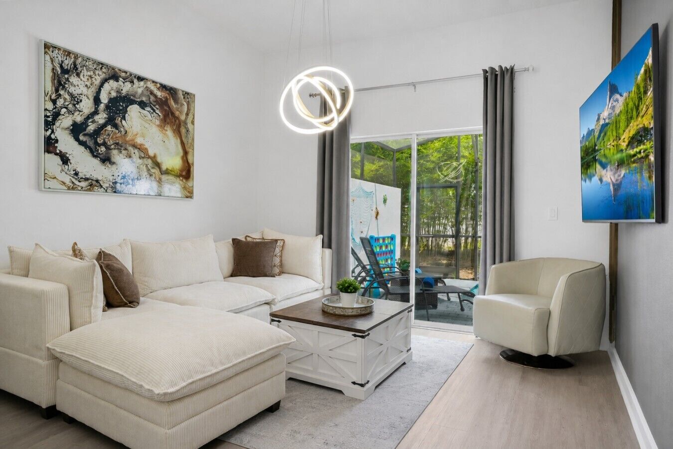 A modern living room with a sofa, coffee table, and a television.