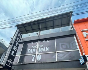 A hotel sign with 'HOTEL SAN JUAN 70' indicating the name and address. - Hotel San Juan70 (Medellín)