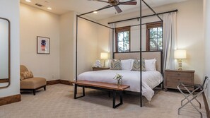 A four-poster canopy bed with a bedside table, a chair, and a lamp. - Mira Vista Vineyard Estate by Avantstay Infinity Pool 82-acre Estate (Paso Robles)