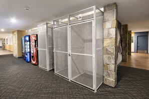 A row of numbered storage lockers with vending machines in the background. - ML 329 - Modern, bike-in/bike-out summer retreat! (Snowshoe)