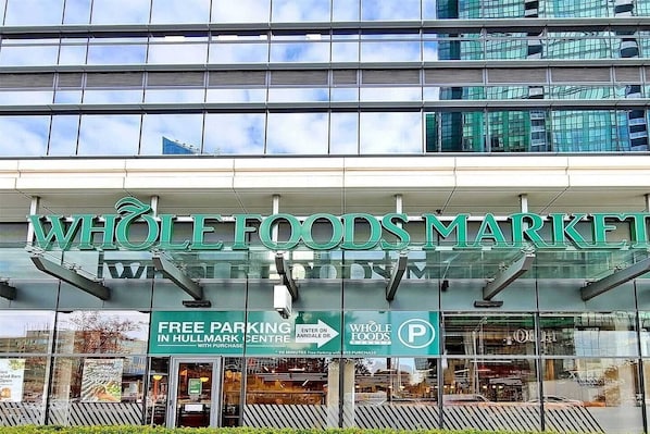 A Whole Foods Market with a sign indicating free parking in Hullmark Centre.