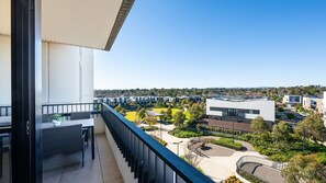 A balcony with a view of a residential area, a modern building, and a clear sky. - The Foundry by Property Mums (Burwood East)