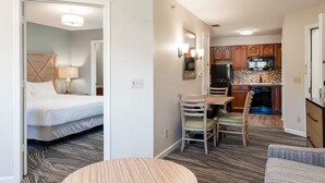 A hotel room with a bed, a desk, and a kitchenette. - Escape to Massanutten: Your Ultimate July 4th Getaway! #1 (Massanutten)