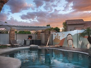 Enjoy an evening swim beneath the Arizona sky and colorful desert mural. - Heated Pool | Putting Green | Game Room | Pets OK (Gilbert)