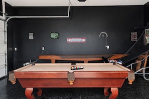 A pool table with a wooden finish, a billiard cue, and a set of balls. - Casa Blanca Old Town Estate + Vineyard View + Pool (Cottonwood)