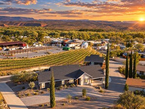A residential area with a vineyard, houses, and a gas station. - Casa Blanca Old Town Estate + Vineyard View + Pool (Cottonwood)