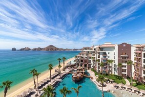 A resort with a pool, beach, and ocean view. - Luxury Pool-View Studio at 5-Star Villa del Arco– Steps to Medano Beach! (cabo san lucas)
