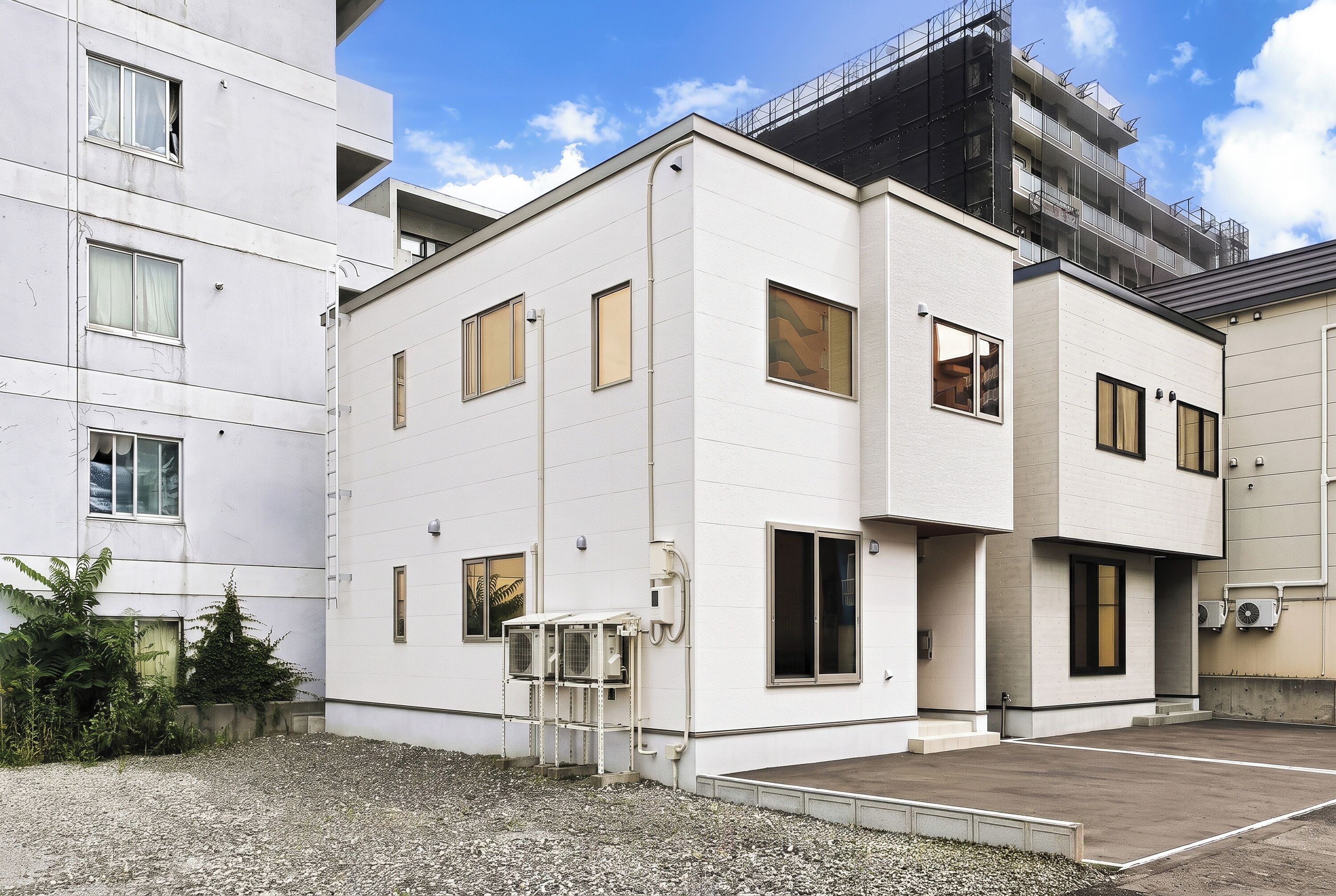 A modern building with multiple windows and a flat roof.
