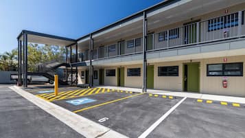 A multi-story parking structure with designated disabled parking spaces.