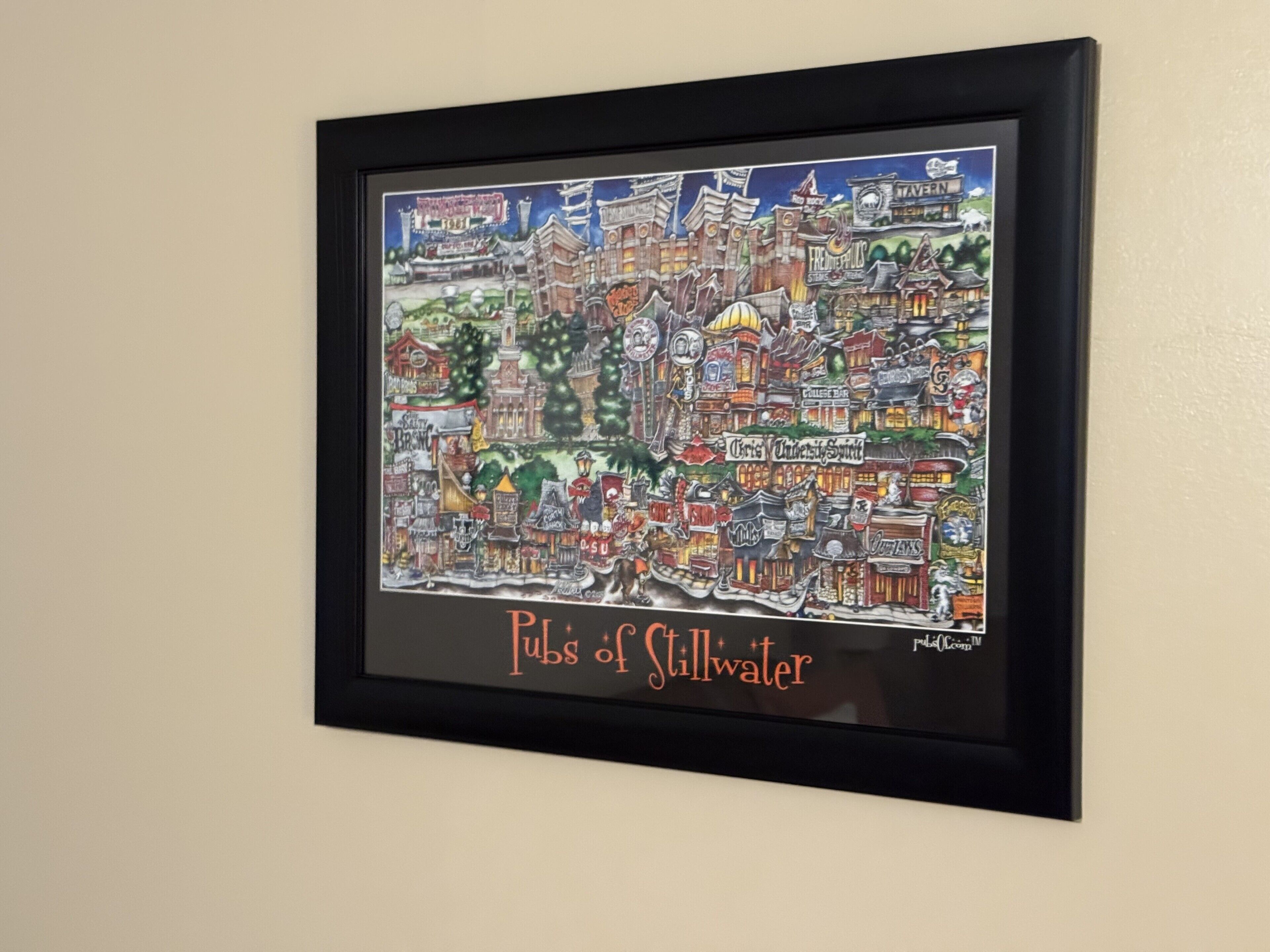 A framed map of a city with various labeled buildings and landmarks.