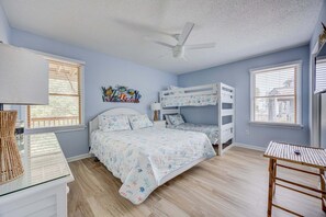 A bedroom with a bunk bed, a desk with a lamp, and a ceiling fan. - 1615 - Smallfield Shores - Oceanside Corolla retreat with 4 bedrooms, ocean view, pool, hot tub. (Corolla)
