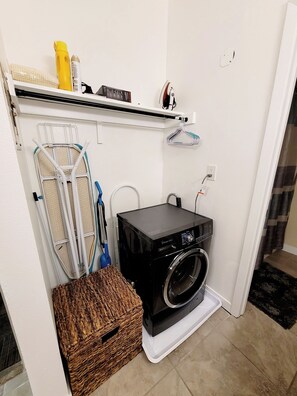 A compact laundry room with a washing machine, a drying rack, and a wicker basket. - 1-bedroom/B Resort On Free Shuttle to Ski IN/Out Historic Main Pool Hottub Trail (Park City)