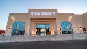 A building with a sign reading 'VITA RESORT' and large glass windows. - Pickalbatros Vita Resort Portofino (Marsa Alam)