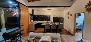 A compact living space with a kitchen, dining area, and seating area.