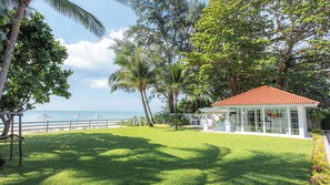 A coastal property with a white gazebo, a red-roofed building, and a view of the sea. - Villa Carpe Diem by Elite Havens (Natai)