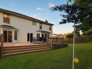 A two-story house with a patio, a deck, and a fenced backyard. - Beautiful Lakeside Home 7 Minutes from Bellerive CC (Chesterfield)