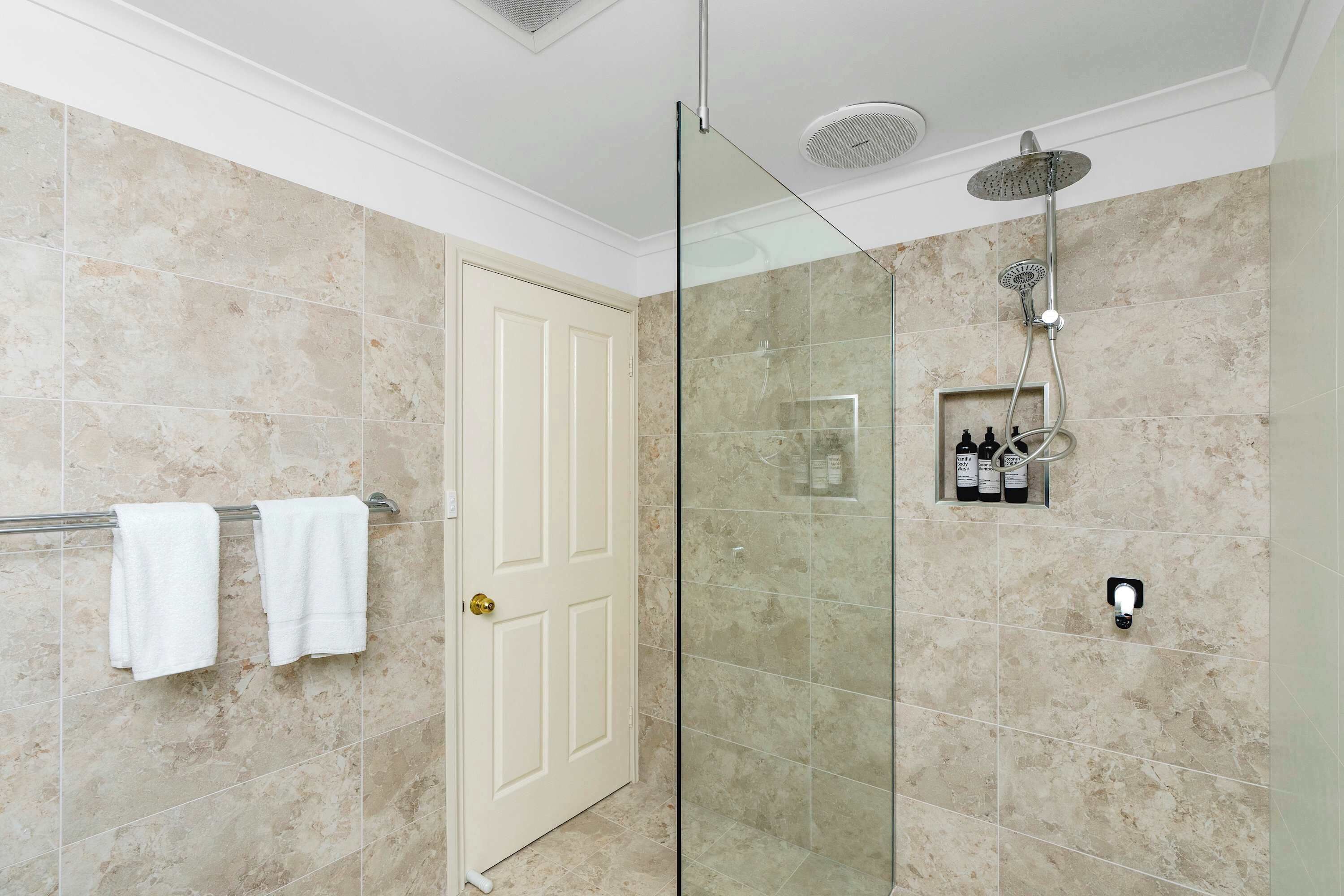 Shower, hair dryer, towels, shampoo