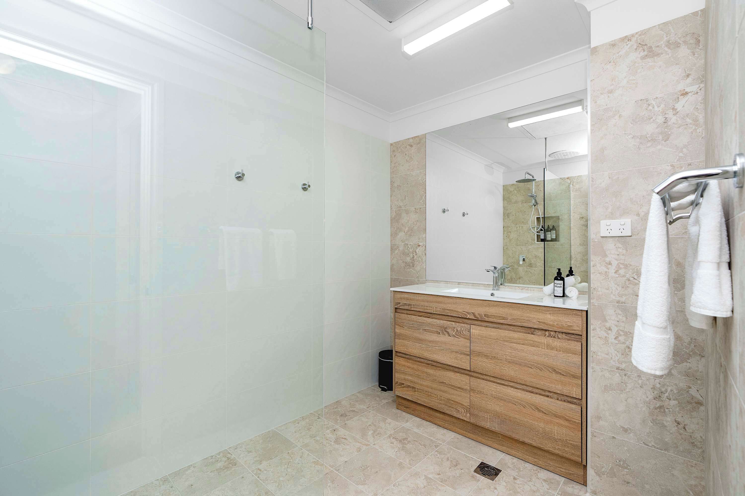 Shower, hair dryer, towels, shampoo