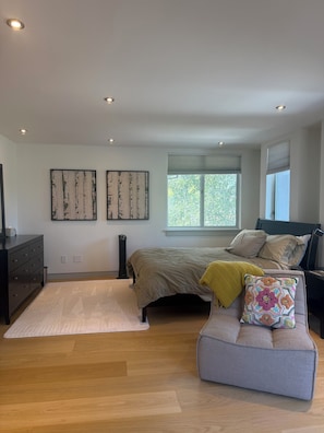 A bedroom with a bed, a nightstand, a dresser, a window with blinds, and two wall-mounted artworks. -  Los Gatos Cozy and Quiet gateway (Los Gatos)