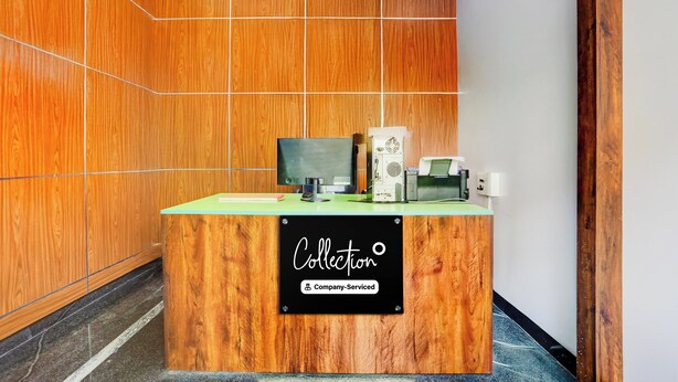 A reception desk with a sign that reads 'Collection' and 'Company-Served'. - Collection O Tirupati Railway (Tirupati)