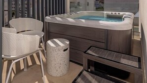 A balcony with a hot tub, seating, and a trash bin. - Cabana White Boutique Hotel & Suites (Kos)