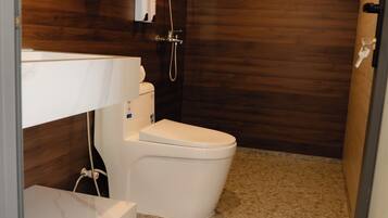Shower, hair dryer, towels, shampoo