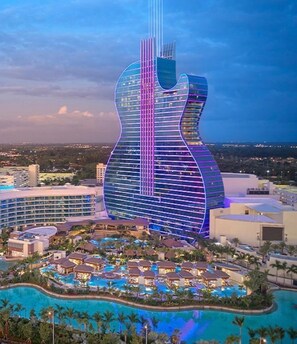 A resort with a large pool area and a distinctive guitar-shaped building. - Bright Oasis, 🏝️Private 4BR Pool&Jacuzzi 🛟 Sleeps 14 🛌 . Hollywood  (Hollywood)