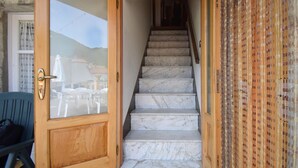 A wooden door with a glass panel, leading to a marble staircase. - 3 bedroom nice apartment in Conca Casale (Conca Casale)