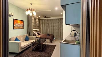 Studio Deluxe, balcon, vue ville | Coin séjour