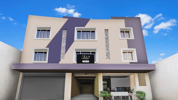 Un edificio moderno con fachada plana, varias ventanas y señalización de empresa.