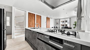 Apartment | Private kitchen | Fridge, microwave, stovetop, dishwasher