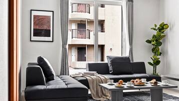 Apartment | Living area | 50-inch flat-screen TV with digital channels