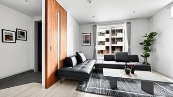 Apartment | Living area | 50-inch flat-screen TV with digital channels