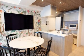 A modern kitchen with a built-in microwave, a sink, and a countertop. - 1 min walk from sta./Excellent access to central (Osaka)