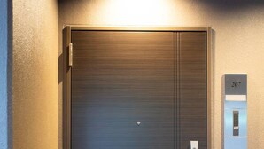 A modern elevator with a metallic finish, a numeric keypad, and a door with a handle. - 1 min walk from sta./Excellent access to central (Osaka)