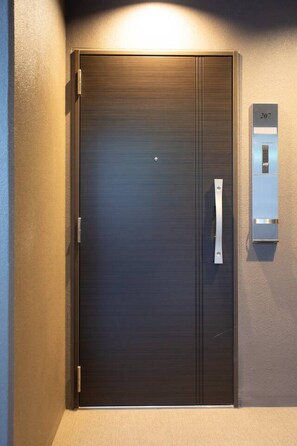 A modern elevator with a metallic finish, a numeric keypad, and a door with a handle. - 1 min walk from sta./Excellent access to central (Osaka)