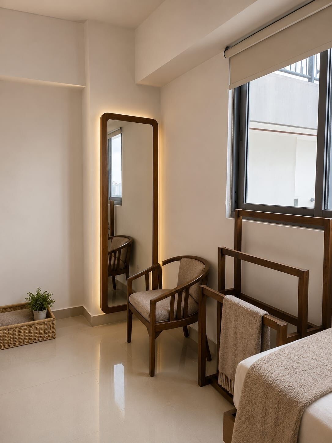 A modern bedroom with a large mirror, two wooden chairs, a bed, and a small potted plant.