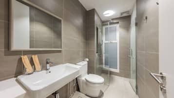 Cozy 3-Bedroom with 3 Beds and 1-Living Room Suite | Bathroom | Shower, hair dryer, slippers, towels