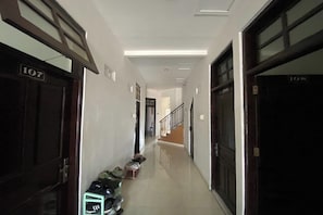 A hallway with doors numbered 107 and 108, leading to rooms.