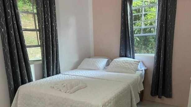 Iron/ironing board, WiFi, bed sheets - Snug Cabin Retreat in Corinth, Gros Islet | A Peaceful & Cozy Getaway (Gros Islet)
