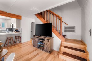 A modern kitchen with white cabinets, a built-in microwave, and a gas stove. - Tree Top Verdon 5BDR with Sauna (South Lake Tahoe)