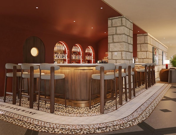 A bar area with a curved wooden bar, multiple bar stools, and a patterned floor. - The Myst Sapa Resort (Sa Pa)