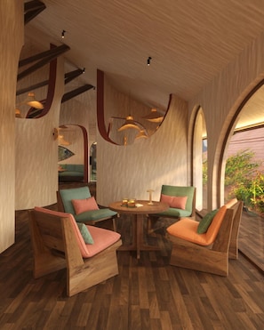 A modern interior with wooden furniture, a round table, and a view through an arched window. - The Myst Sapa Resort (Sa Pa)