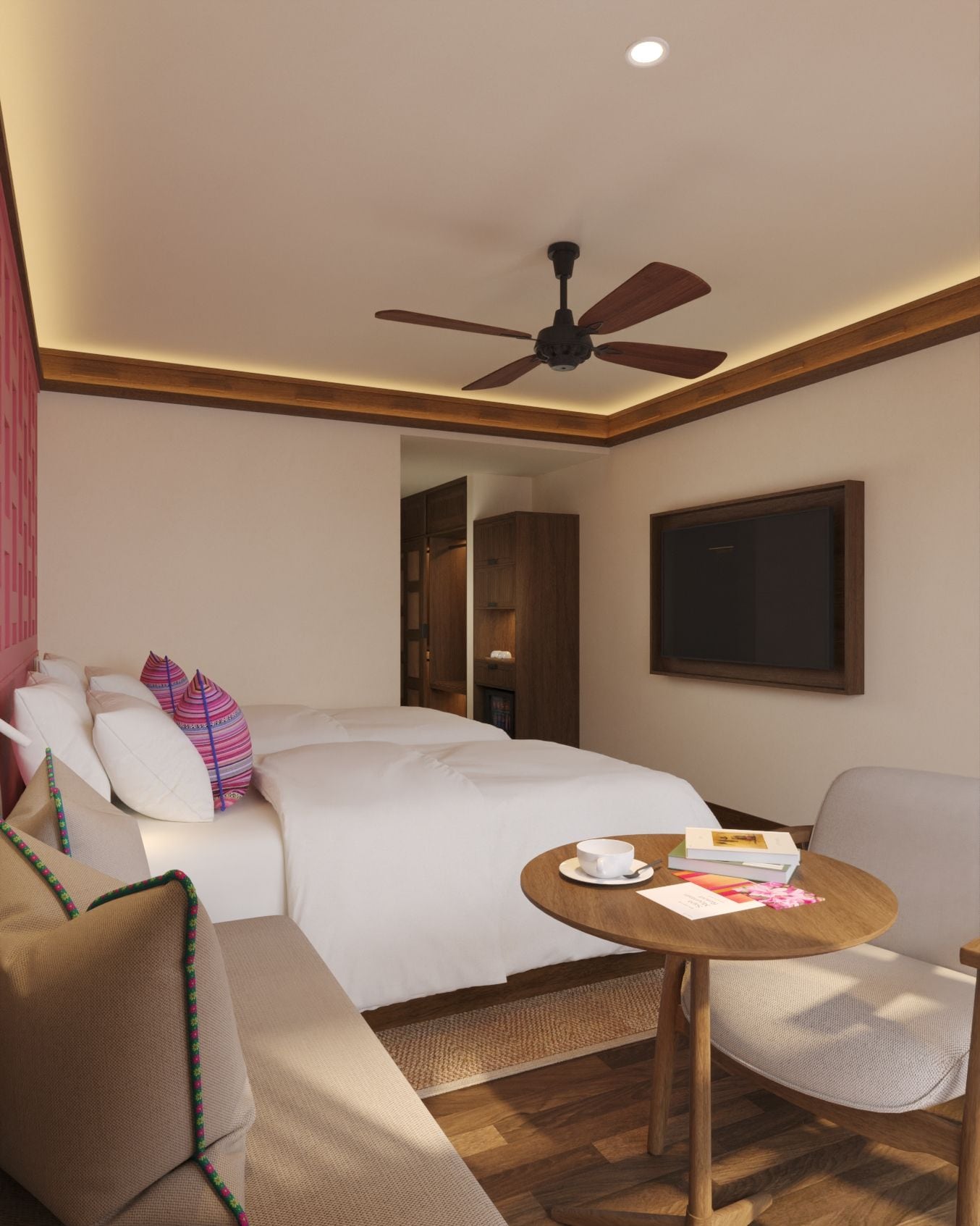 A hotel room with a bed, a seating area with a table, a ceiling fan, and a door leading to another room.